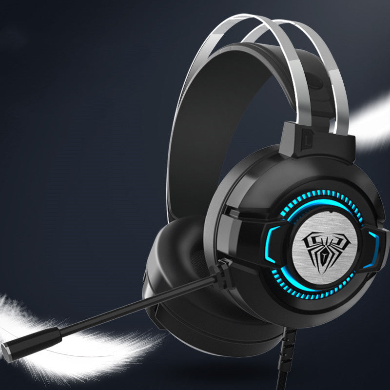 S602 over-ear gaming headset in black with silver headband and blue LED ring