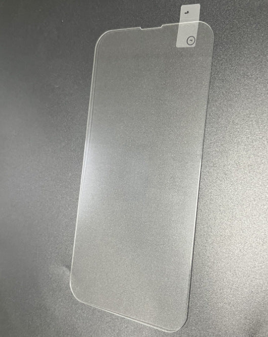 Clear tempered glass screen protector sheet lying flat on a gray background